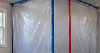 Containment barriers set up for mold remediation