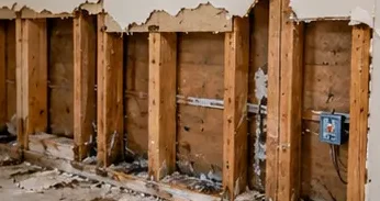 Wet drywall opened up to dry the wall cavity